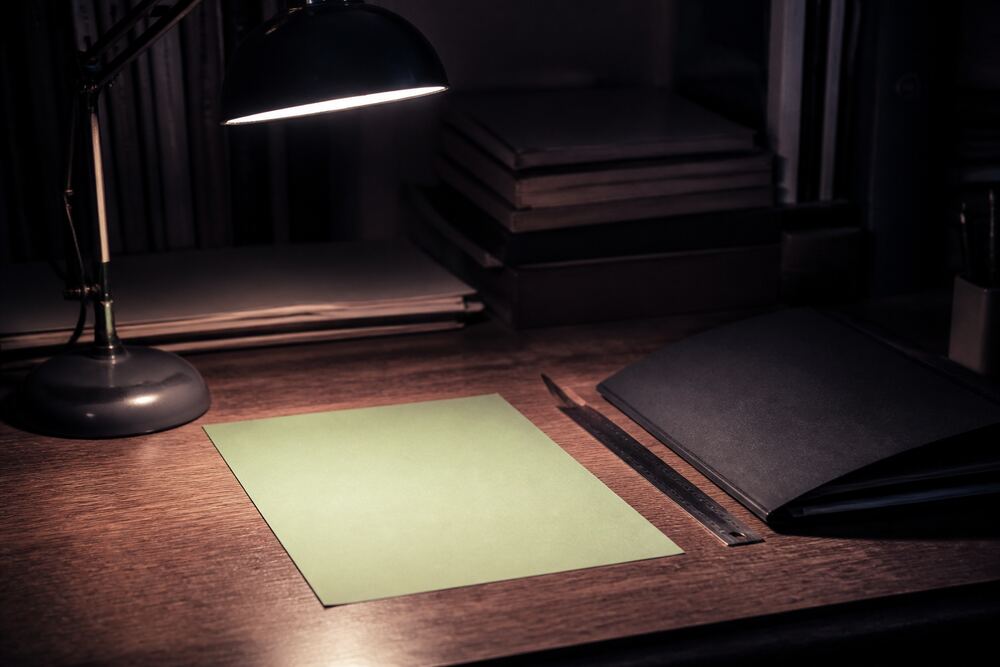 A research desk detail with labeled paper tabs and a source note for private-market context, q1 2026